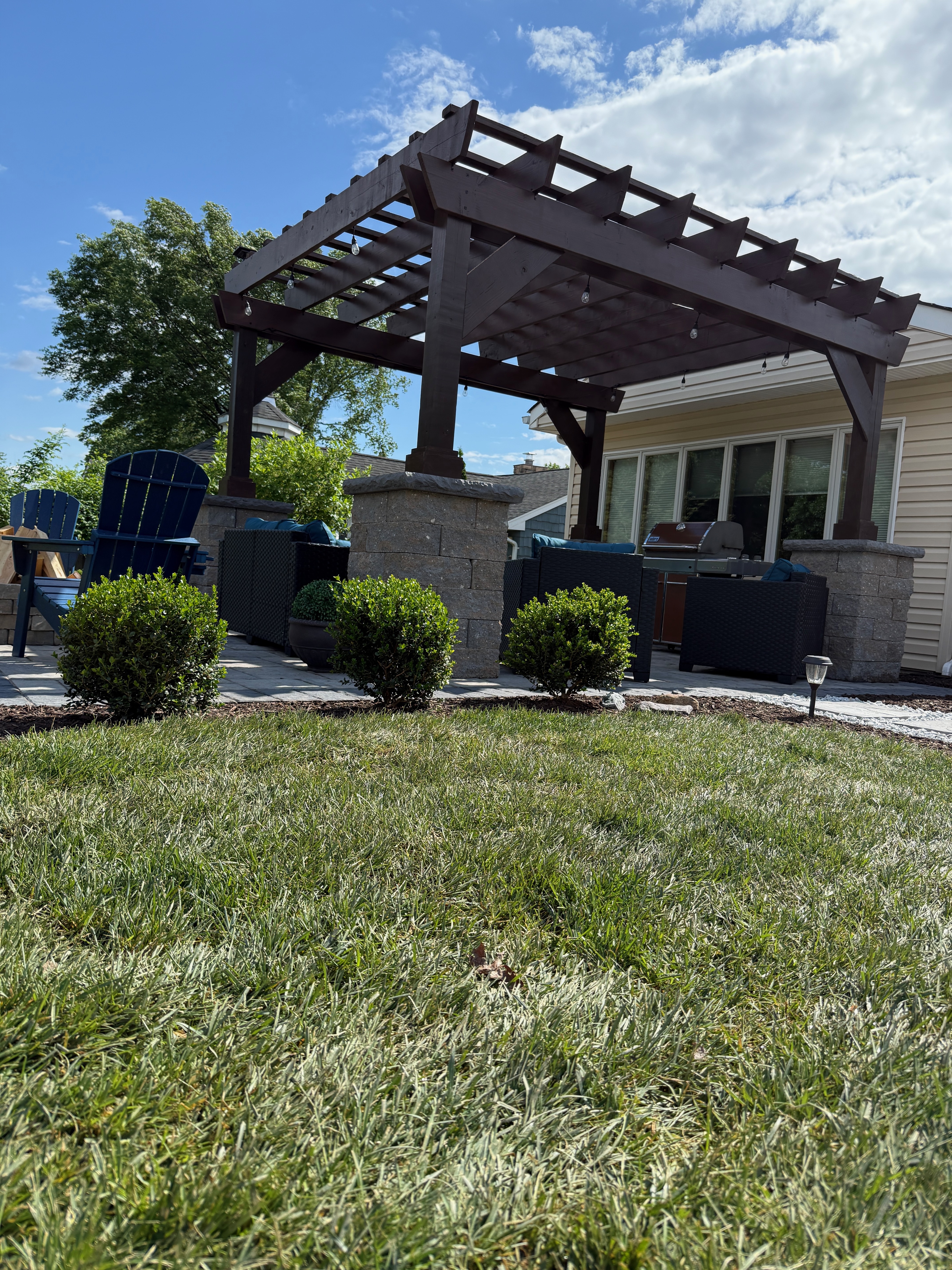 Custom pergola with stone columns